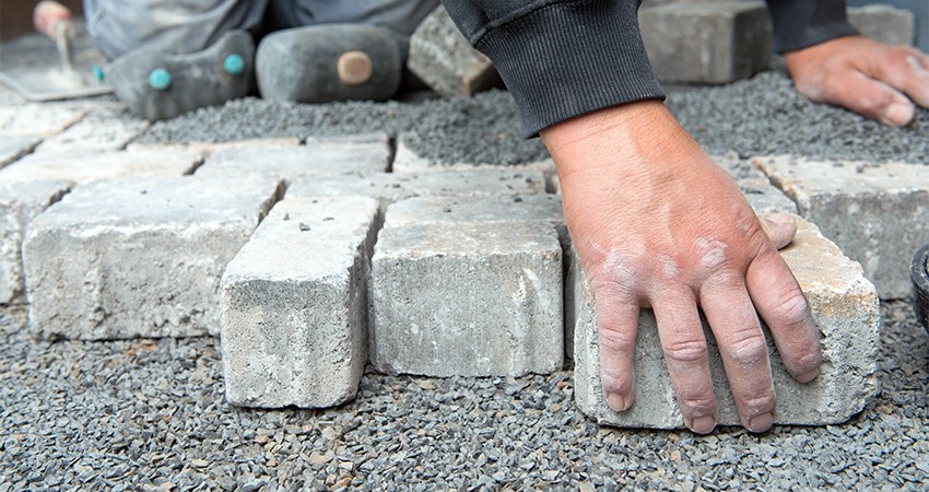A professional landscaper working on a project, using their expertise and tools to create a beautiful and functional outdoor space